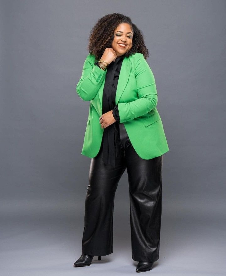 Kyra — green blazer, black wide-leg leather pants, full-length studio