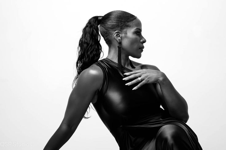 Regina — black dress, B&W profile editorial