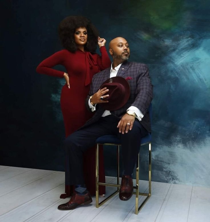 The Suttons — couples portrait, burgundy and navy, teal studio backdrop