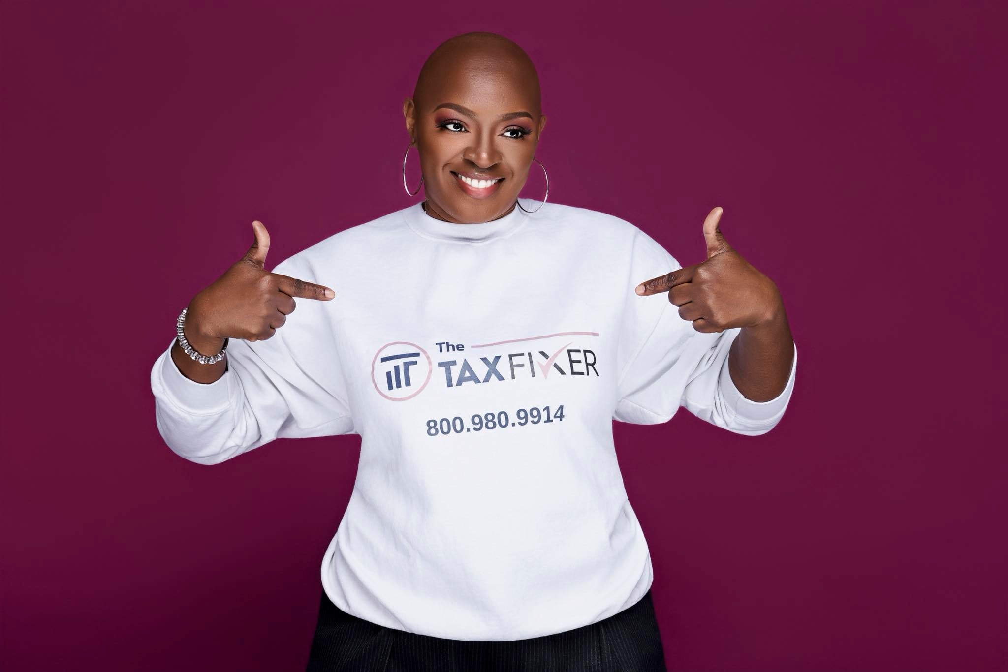 The Tax Fixer — branded sweatshirt, magenta background